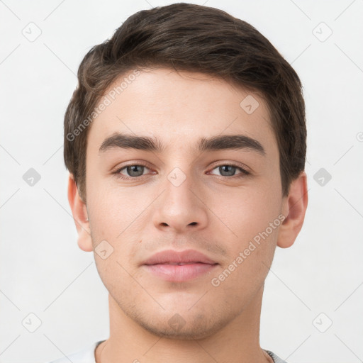 Neutral white young-adult male with short  brown hair and grey eyes