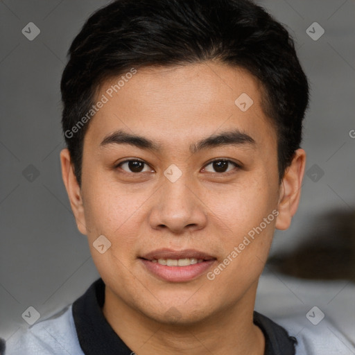 Joyful asian young-adult male with short  brown hair and brown eyes