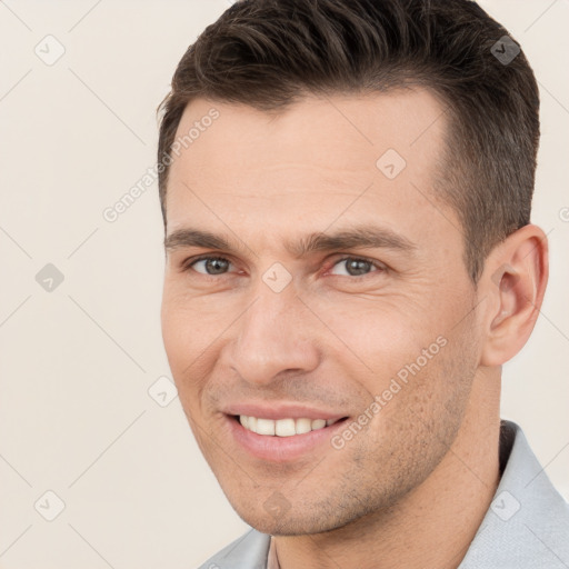 Joyful white young-adult male with short  brown hair and brown eyes