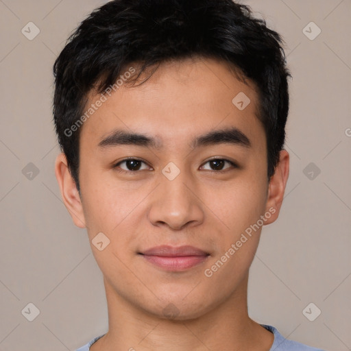 Joyful asian young-adult male with short  black hair and brown eyes