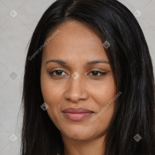 Joyful black young-adult female with long  black hair and brown eyes