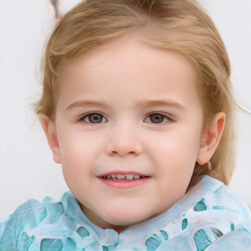 Joyful white child female with short  brown hair and blue eyes