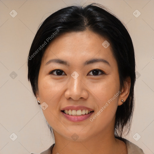 Joyful asian young-adult female with medium  black hair and brown eyes