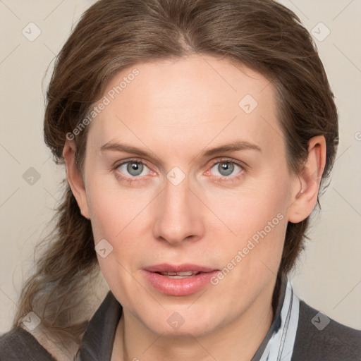 Joyful white young-adult female with medium  brown hair and blue eyes