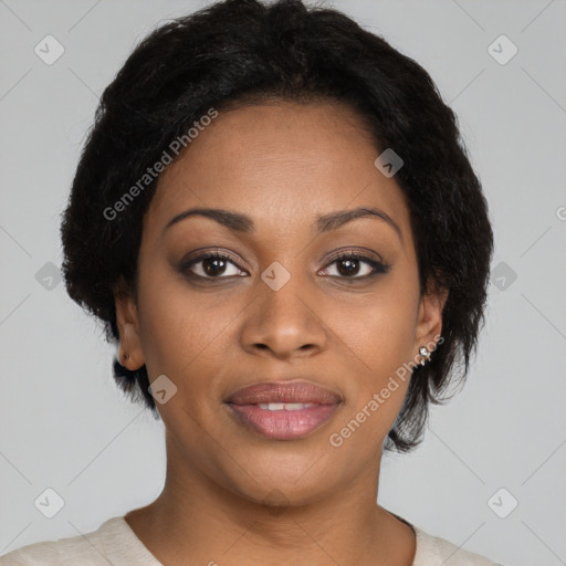 Joyful black young-adult female with short  black hair and brown eyes