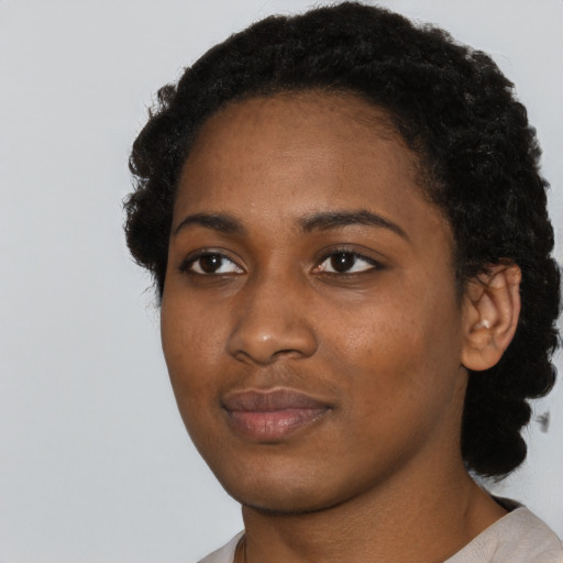 Neutral black young-adult female with short  black hair and brown eyes