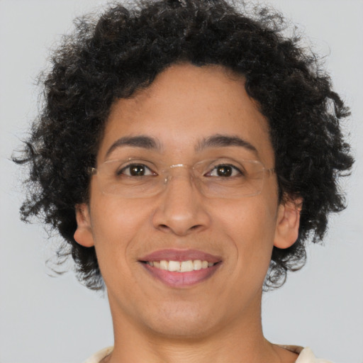 Joyful latino adult female with short  brown hair and brown eyes