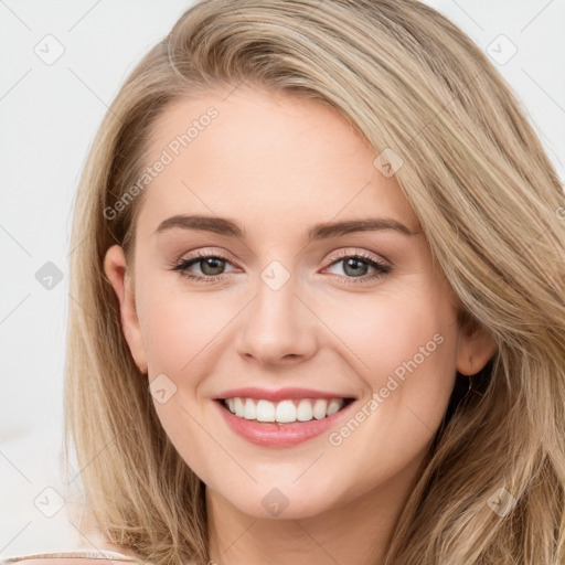 Joyful white young-adult female with long  brown hair and blue eyes