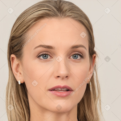 Joyful white young-adult female with long  brown hair and blue eyes