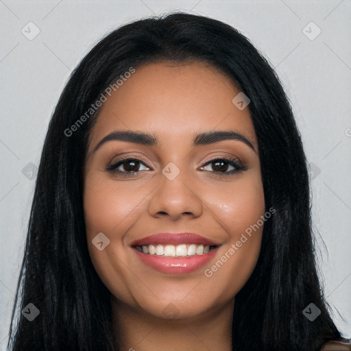 Joyful latino young-adult female with long  black hair and brown eyes