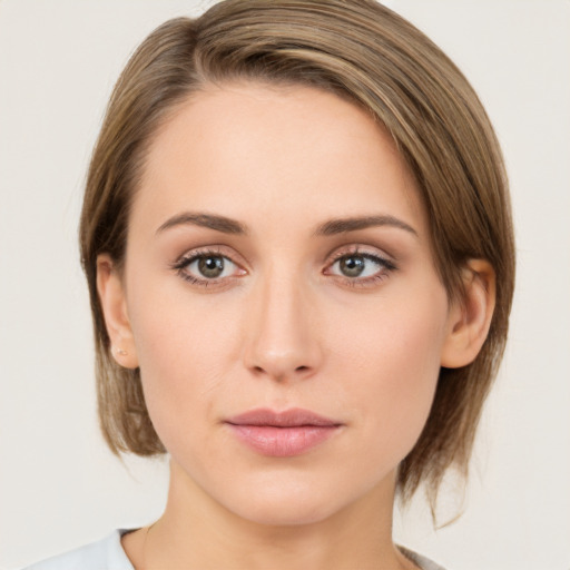 Neutral white young-adult female with medium  brown hair and green eyes