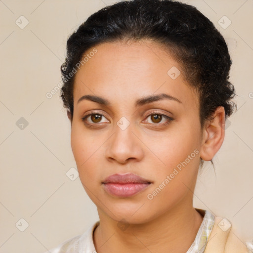 Joyful latino young-adult female with short  brown hair and brown eyes