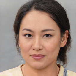 Joyful asian young-adult female with medium  brown hair and brown eyes