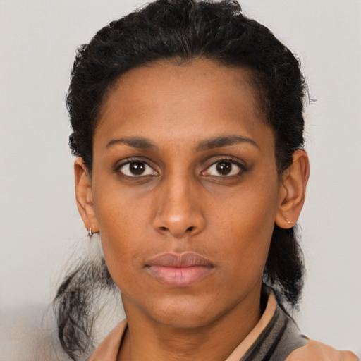 Neutral black young-adult female with short  brown hair and brown eyes