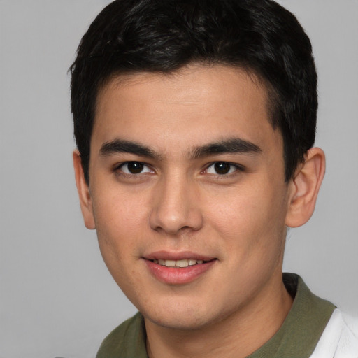 Joyful asian young-adult male with short  brown hair and brown eyes