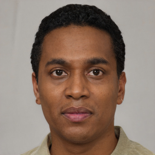 Neutral black young-adult male with short  black hair and brown eyes