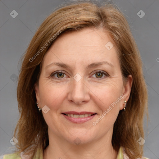 Joyful white adult female with medium  brown hair and brown eyes