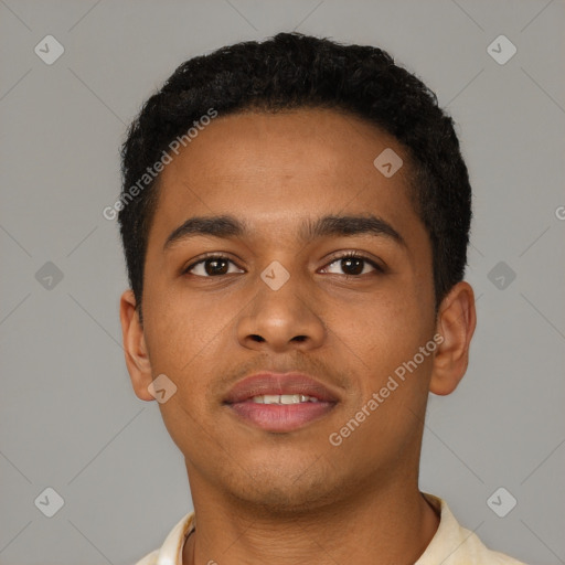 Joyful black young-adult male with short  brown hair and brown eyes