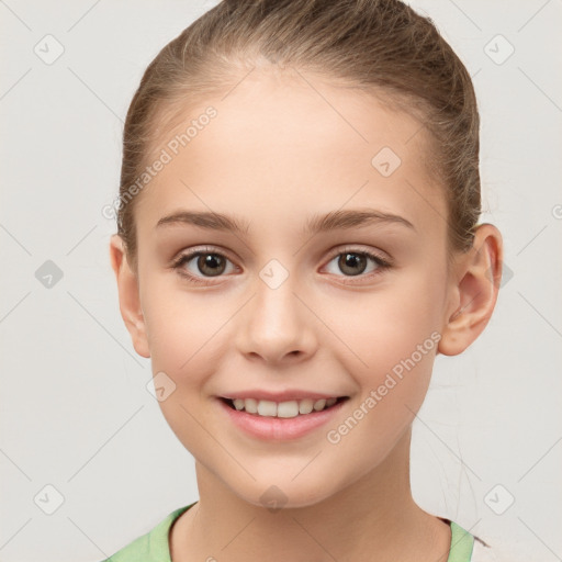 Joyful white child female with short  brown hair and brown eyes