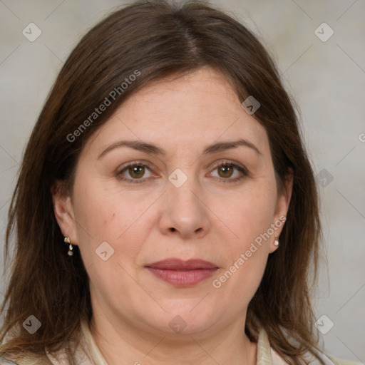 Joyful white adult female with medium  brown hair and brown eyes