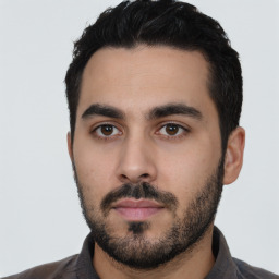 Neutral latino young-adult male with short  black hair and brown eyes