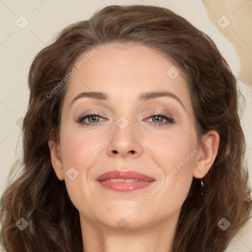 Joyful white adult female with long  brown hair and brown eyes