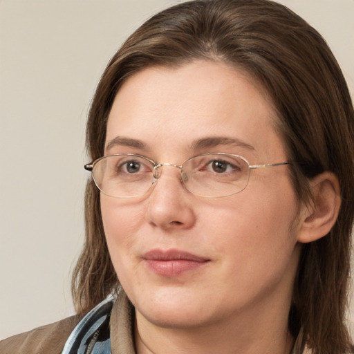 Joyful white adult female with medium  brown hair and brown eyes