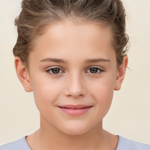 Joyful white child female with short  brown hair and brown eyes