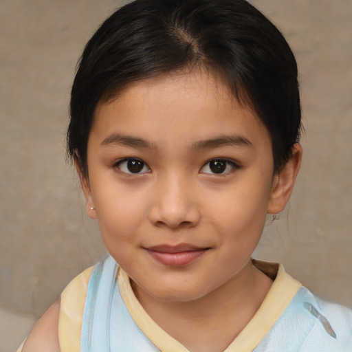 Joyful asian child female with medium  brown hair and brown eyes