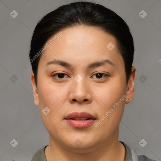 Joyful asian young-adult female with short  black hair and brown eyes