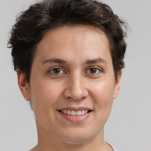 Joyful white adult female with short  brown hair and brown eyes