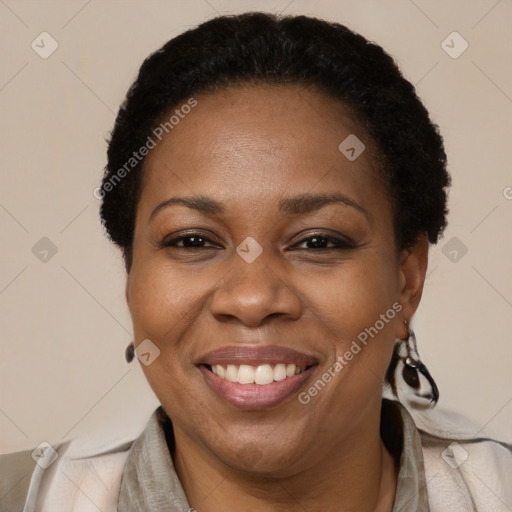 Joyful black adult female with short  brown hair and brown eyes