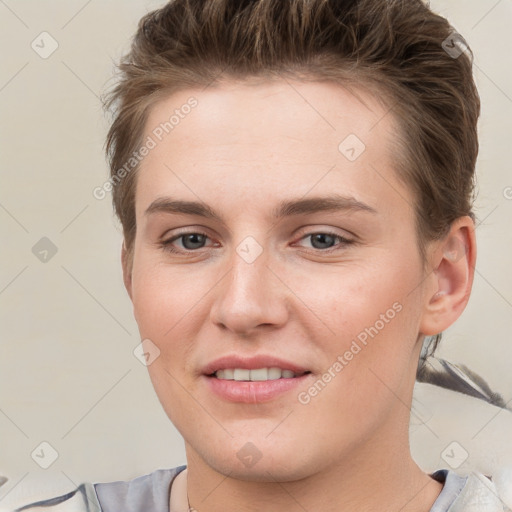 Joyful white young-adult female with short  brown hair and grey eyes