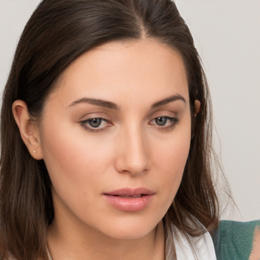 Neutral white young-adult female with medium  brown hair and brown eyes