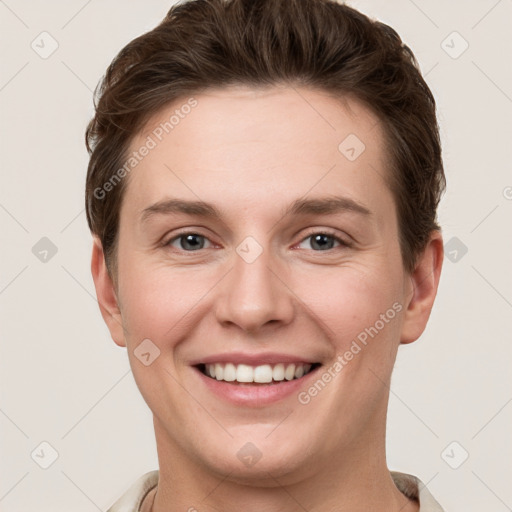 Joyful white young-adult female with short  brown hair and grey eyes