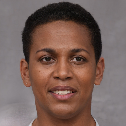Joyful black young-adult female with short  brown hair and brown eyes