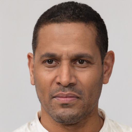 Neutral latino adult male with short  black hair and brown eyes