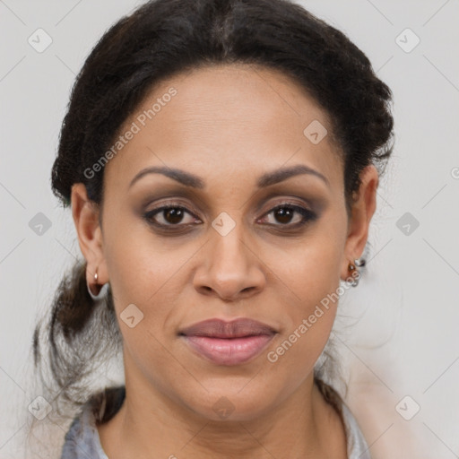 Joyful latino adult female with medium  brown hair and brown eyes