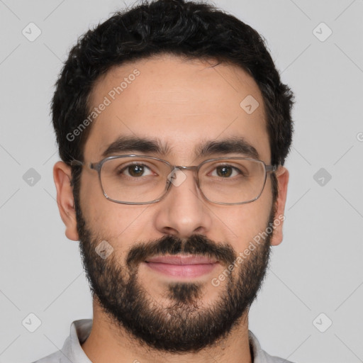 Joyful white young-adult male with short  black hair and brown eyes