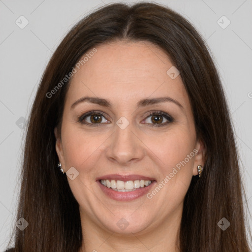 Joyful white adult female with long  brown hair and brown eyes