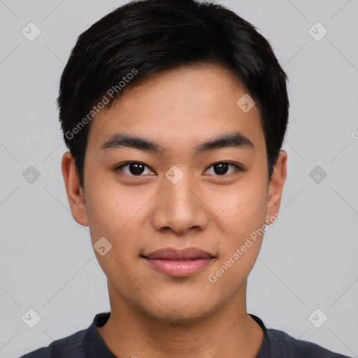 Joyful asian young-adult male with short  black hair and brown eyes