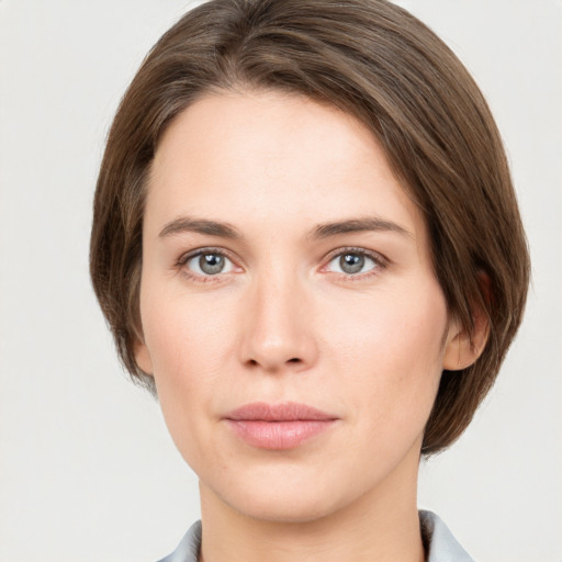 Neutral white young-adult female with medium  brown hair and grey eyes