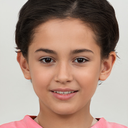 Joyful white child female with short  brown hair and brown eyes