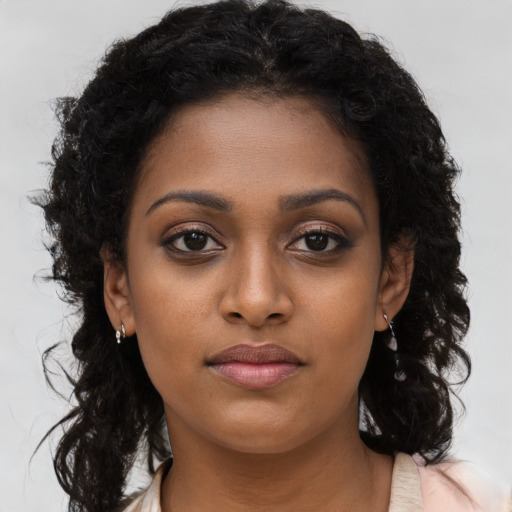 Neutral black young-adult female with long  brown hair and brown eyes