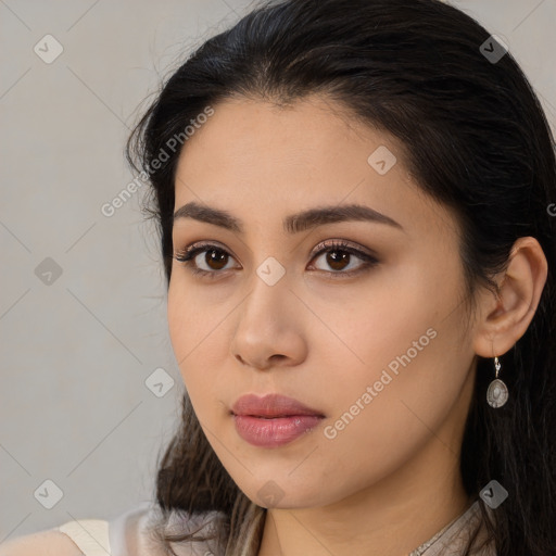 Neutral latino young-adult female with long  brown hair and brown eyes