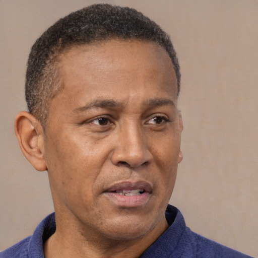 Neutral latino adult male with short  brown hair and brown eyes