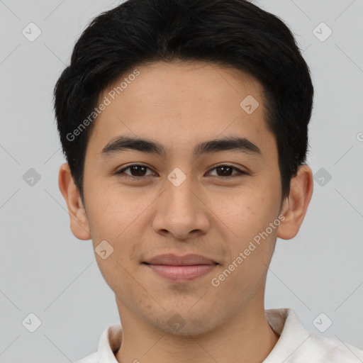 Joyful latino young-adult male with short  brown hair and brown eyes