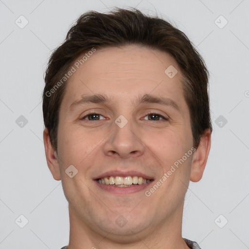 Joyful white adult male with short  brown hair and brown eyes