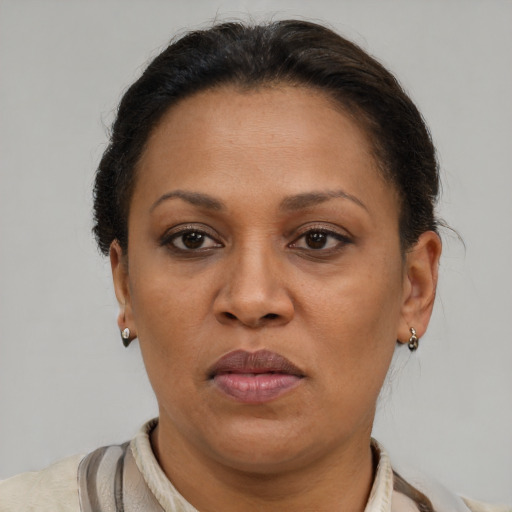 Joyful latino adult female with short  brown hair and brown eyes