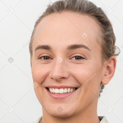 Joyful white young-adult female with short  brown hair and brown eyes